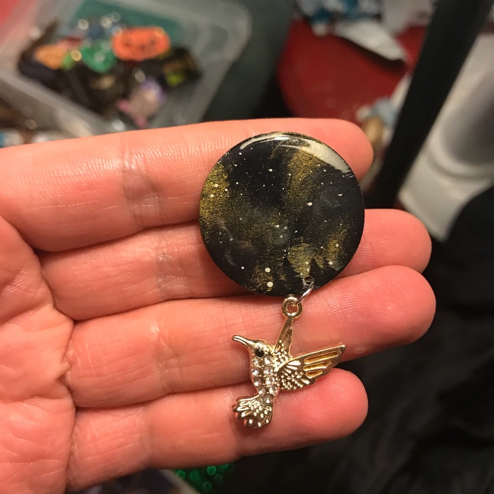 Gold and black pin